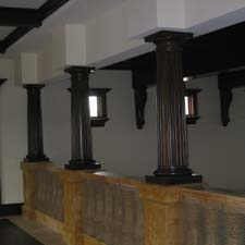 fluted interior decorative columns on top of a balustrade railing